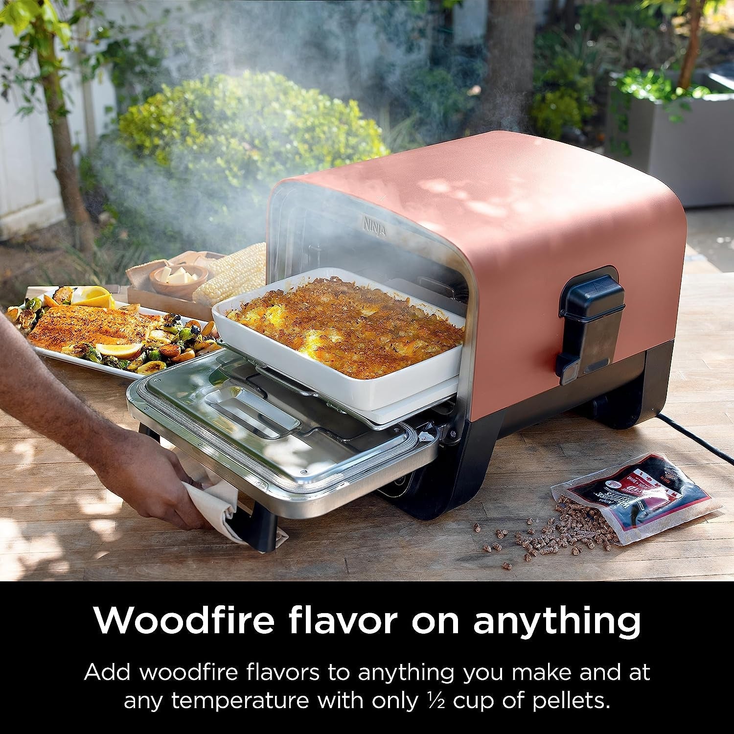 Woodfire Pizza Oven. 8-In-1 Outdoor Oven. 5 Pizza Settings. Woodfire Technology. 700°F High Heat. BBQ Smoker. Wood Pellets. Pizza Stone. Electric Heat. Portable. Terracotta Red. OO101 - Image 8